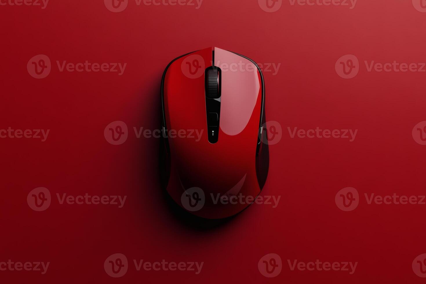 Sleek red computer mouse on vibrant red background. photo