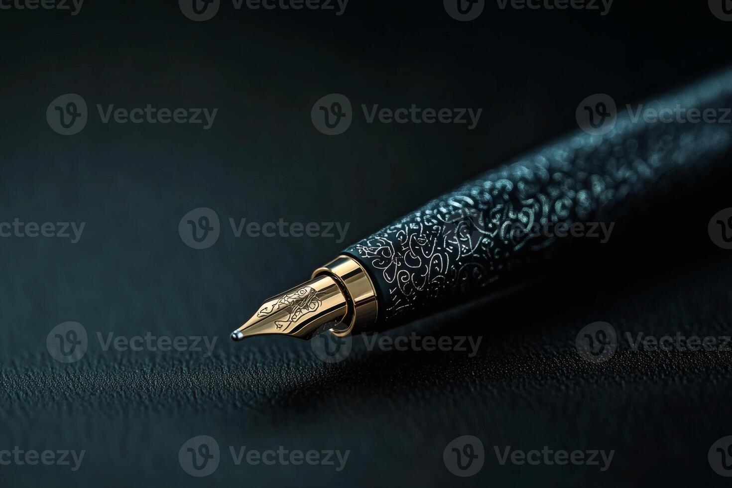 Intricate fountain pen resting on a textured surface. photo