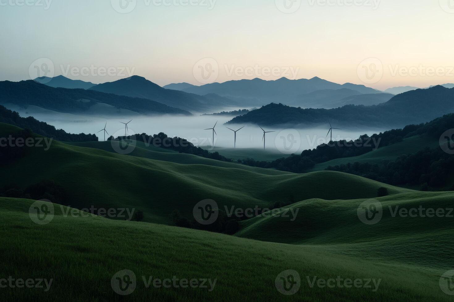 Serenity of dawn over rolling hills and wind turbines. photo
