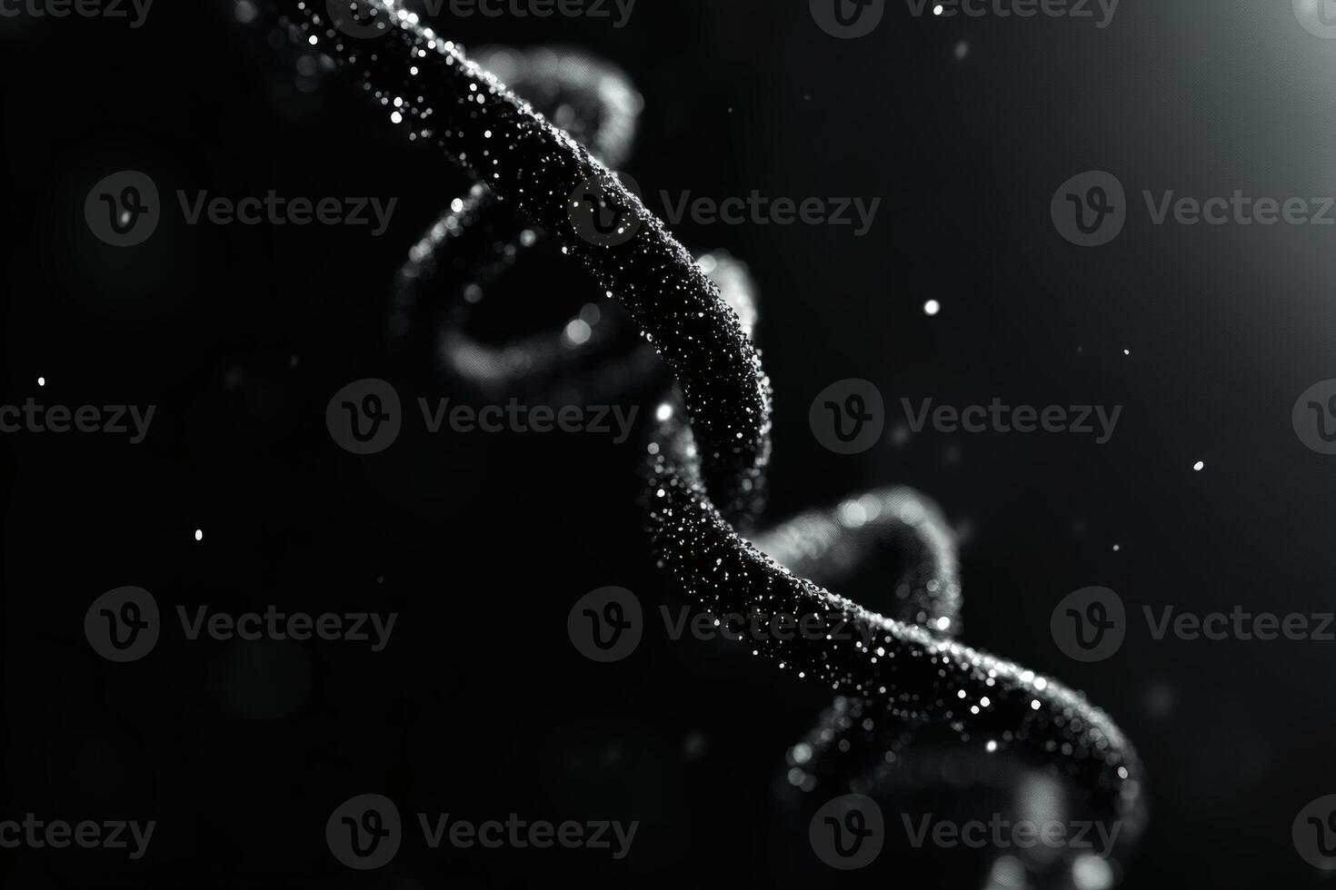 Swirling particles create a mesmerizing dance in darkness. photo