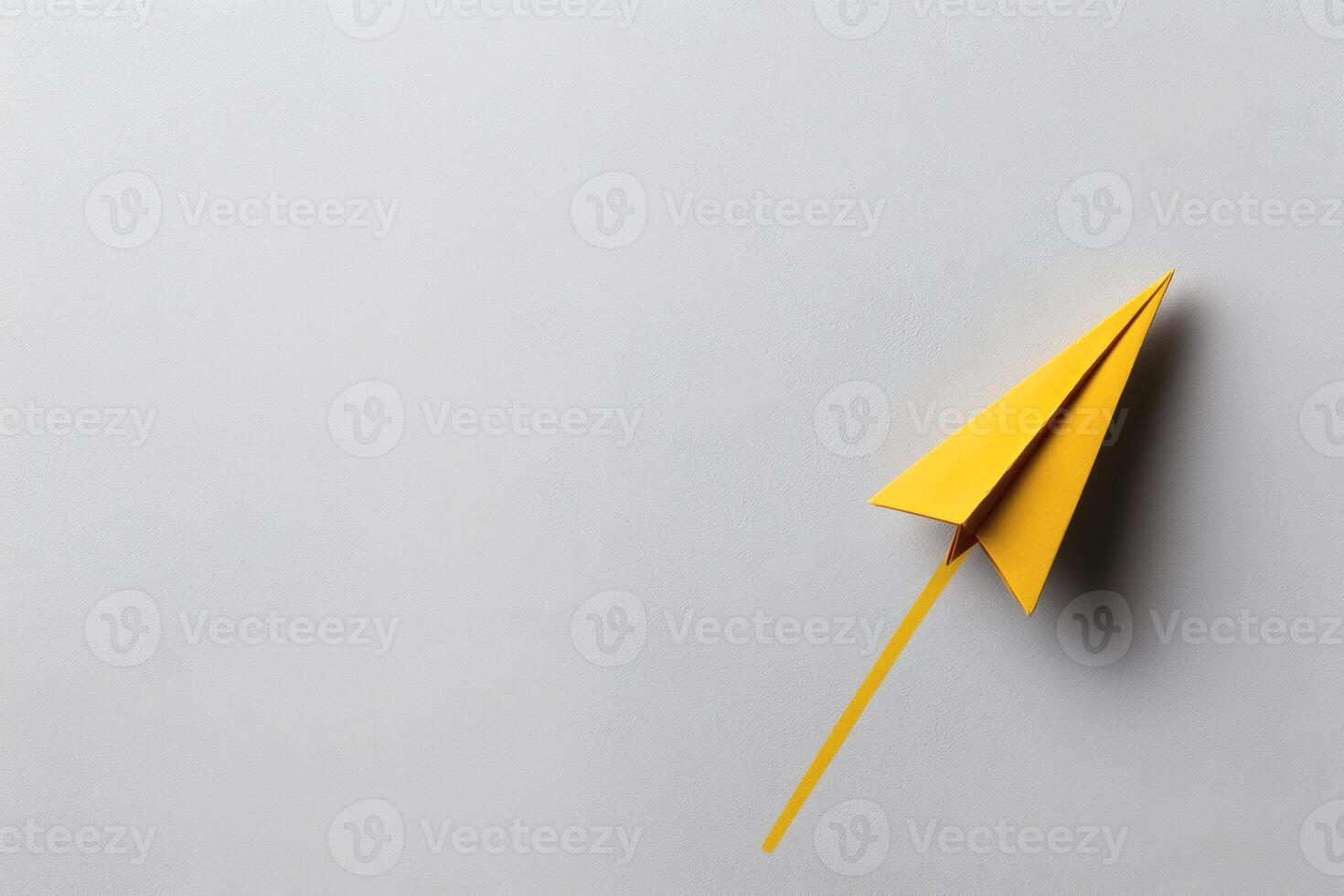 Crafting joy with a vibrant yellow paper airplane. photo