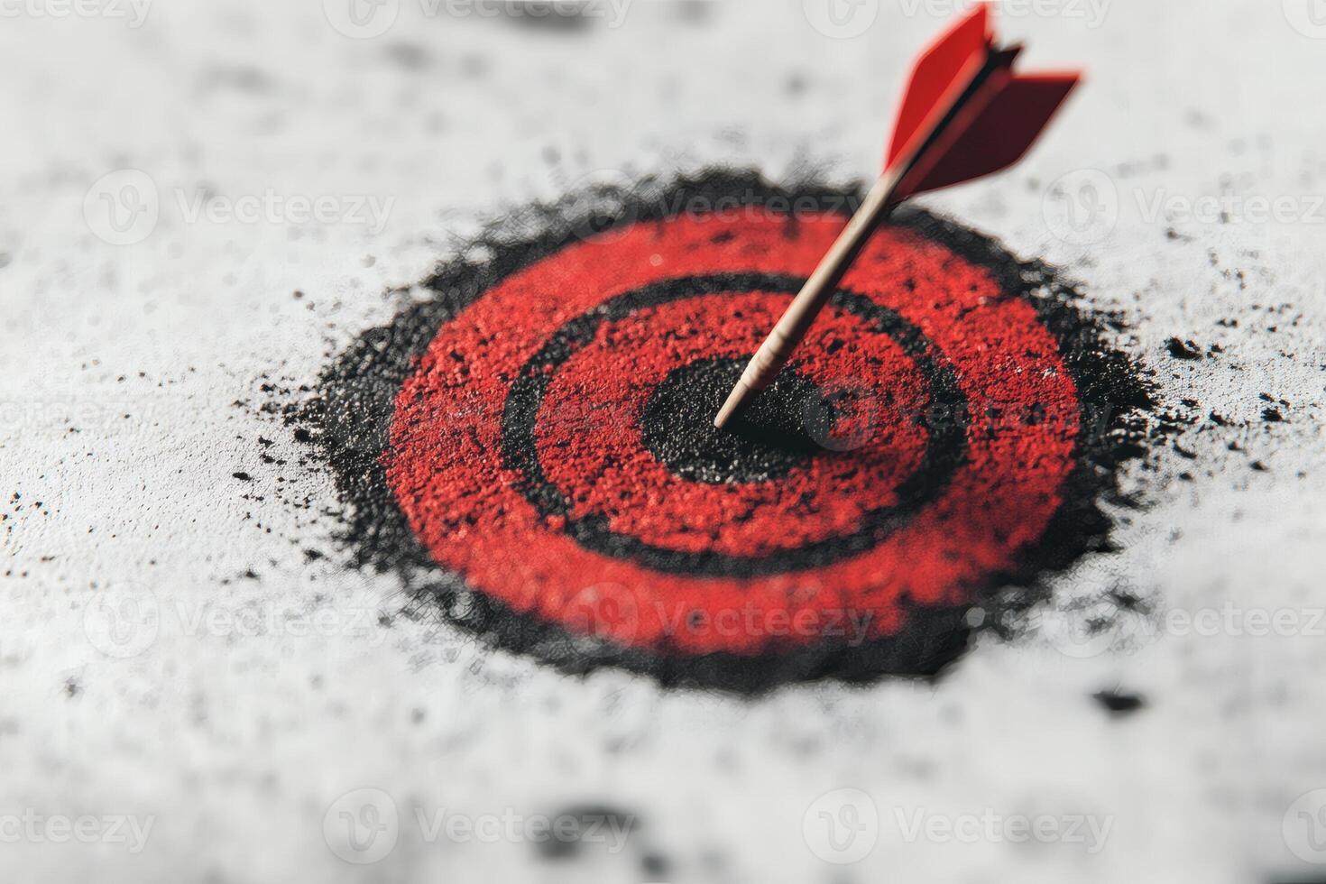 Arrows striking the bullseye on a vibrant red target at a competitive event. photo