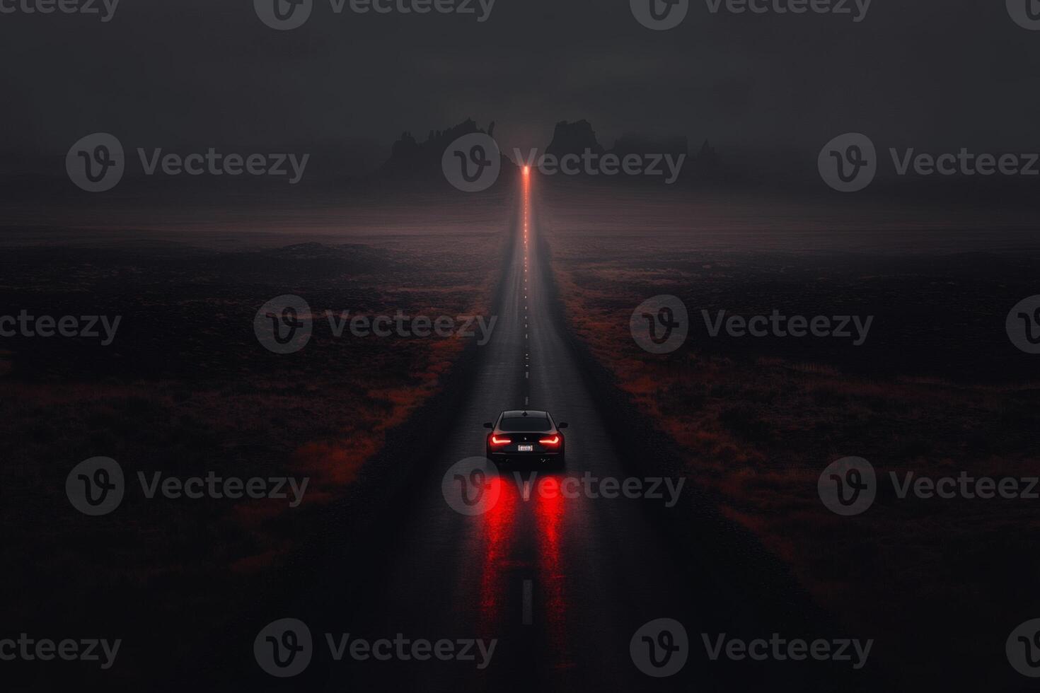 Mysterious road illuminated by a car under a dark, moody sky at dusk. photo