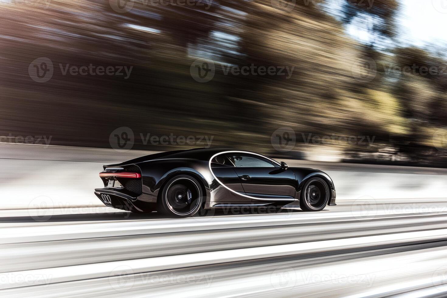 Sleek black sports car speeding through an urban landscape at dusk. photo