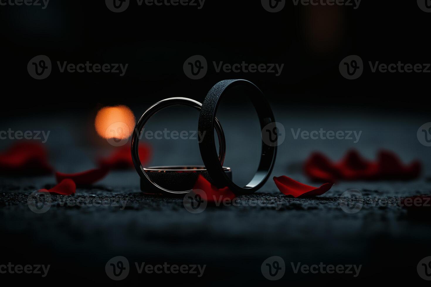 Rustic elegance of intertwined wedding rings surrounded by rose petals at twilight. photo