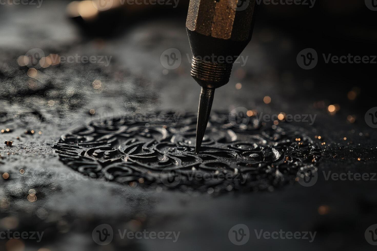 Intricate Design Being Created With Precision Tool on Dark Surface. photo