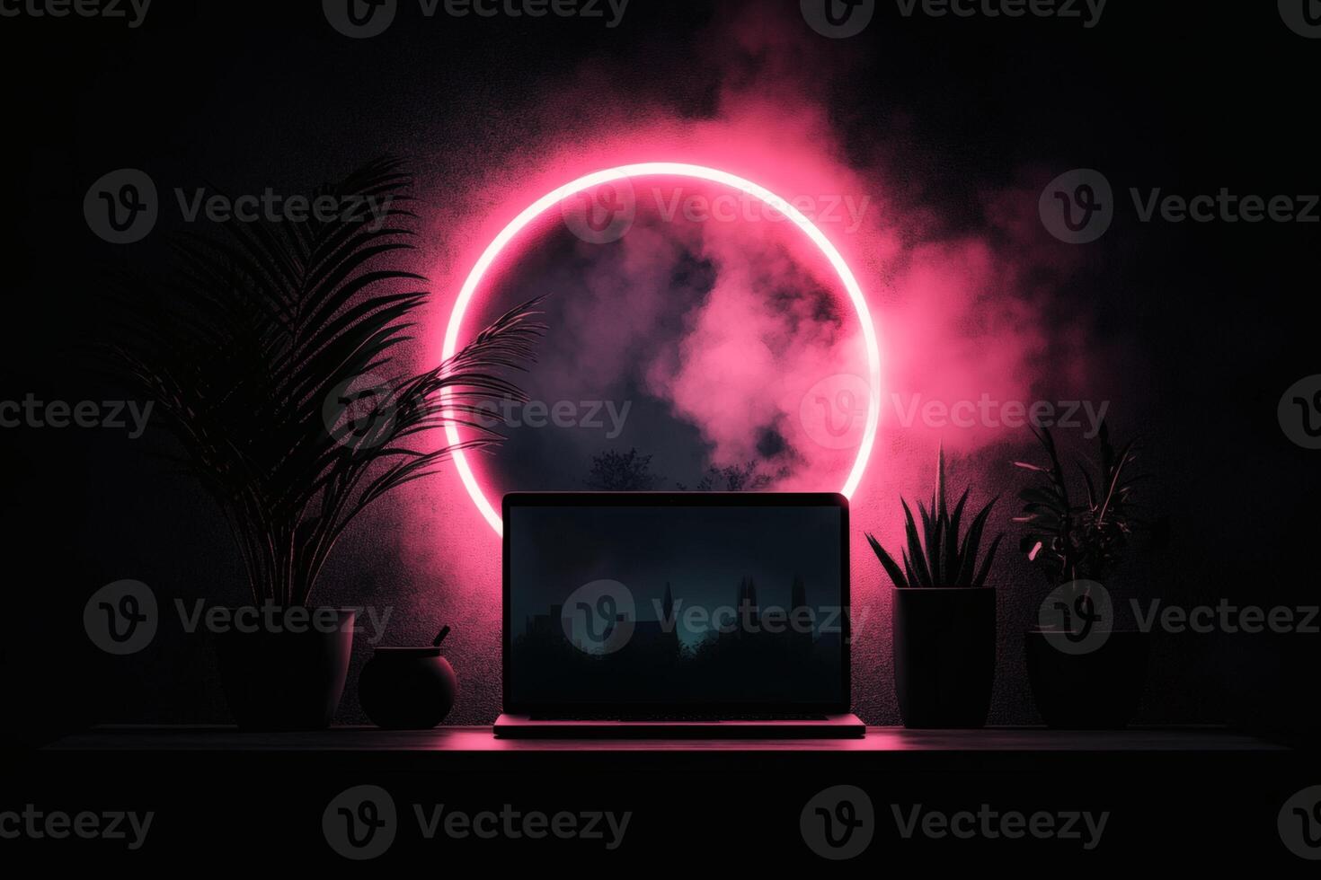 Laptop Resting on Table Surrounded by Plants With a Pink Neon Light at Night. photo