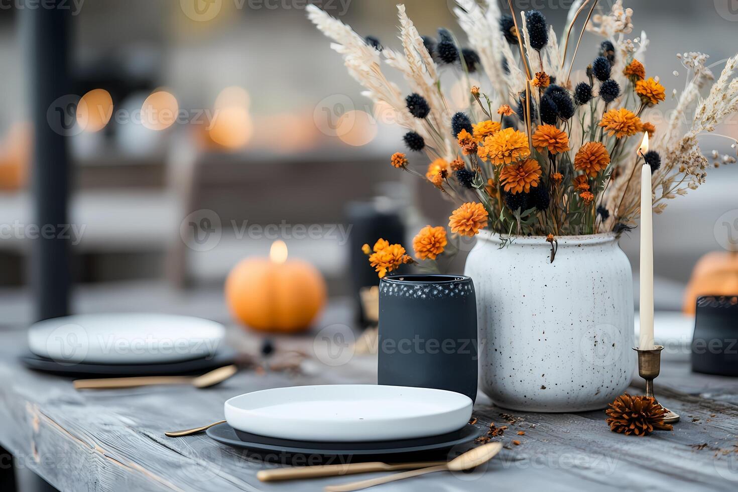 Elegant Autumn Table Setting With Flowers and Candles for a Cozy Gathering. photo