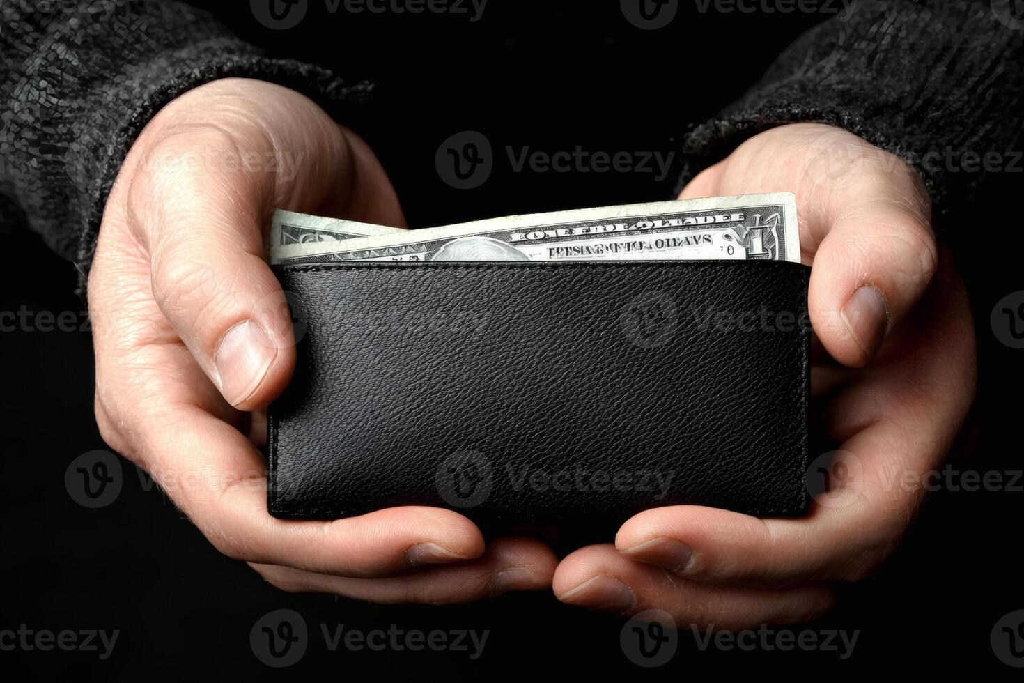 Hands holding a wallet with cash photo