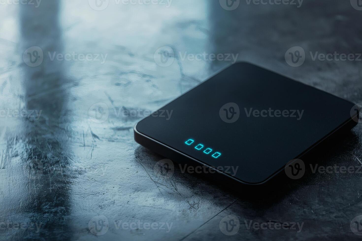 Digital scale rests on a sleek surface photo