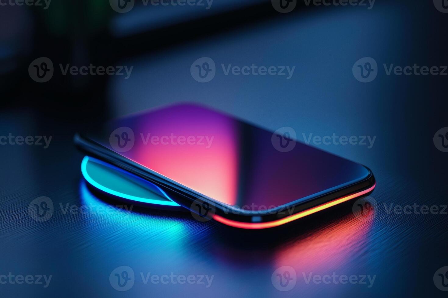 Vibrant smartphone charging on a glowing pad photo