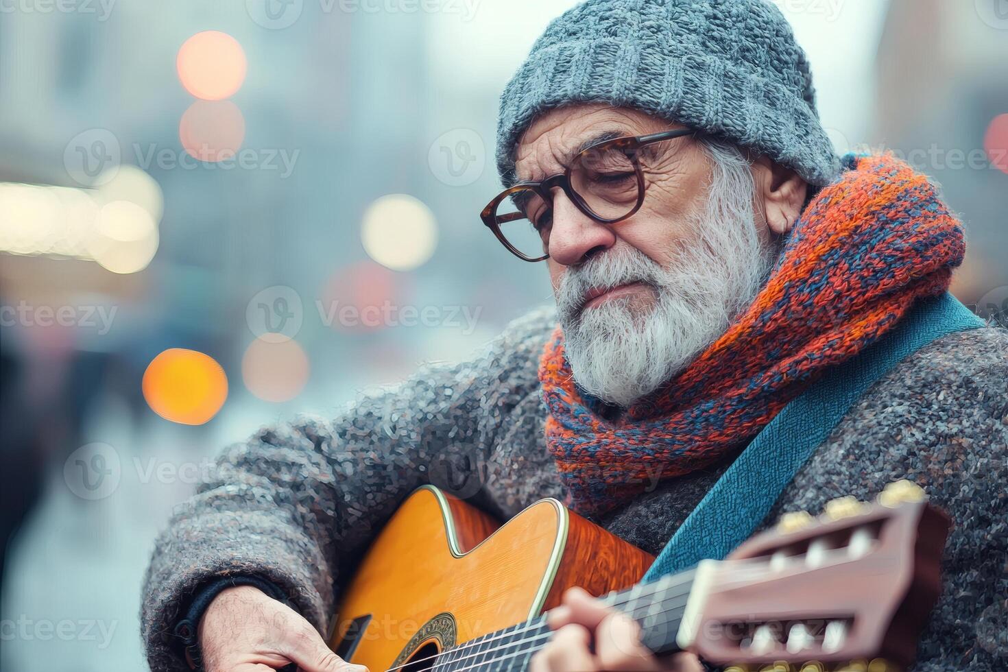 Elderly musician strums guitar in winter city photo