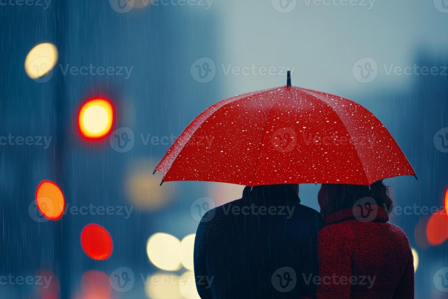 Cozy embrace under a vibrant umbrella in rain photo