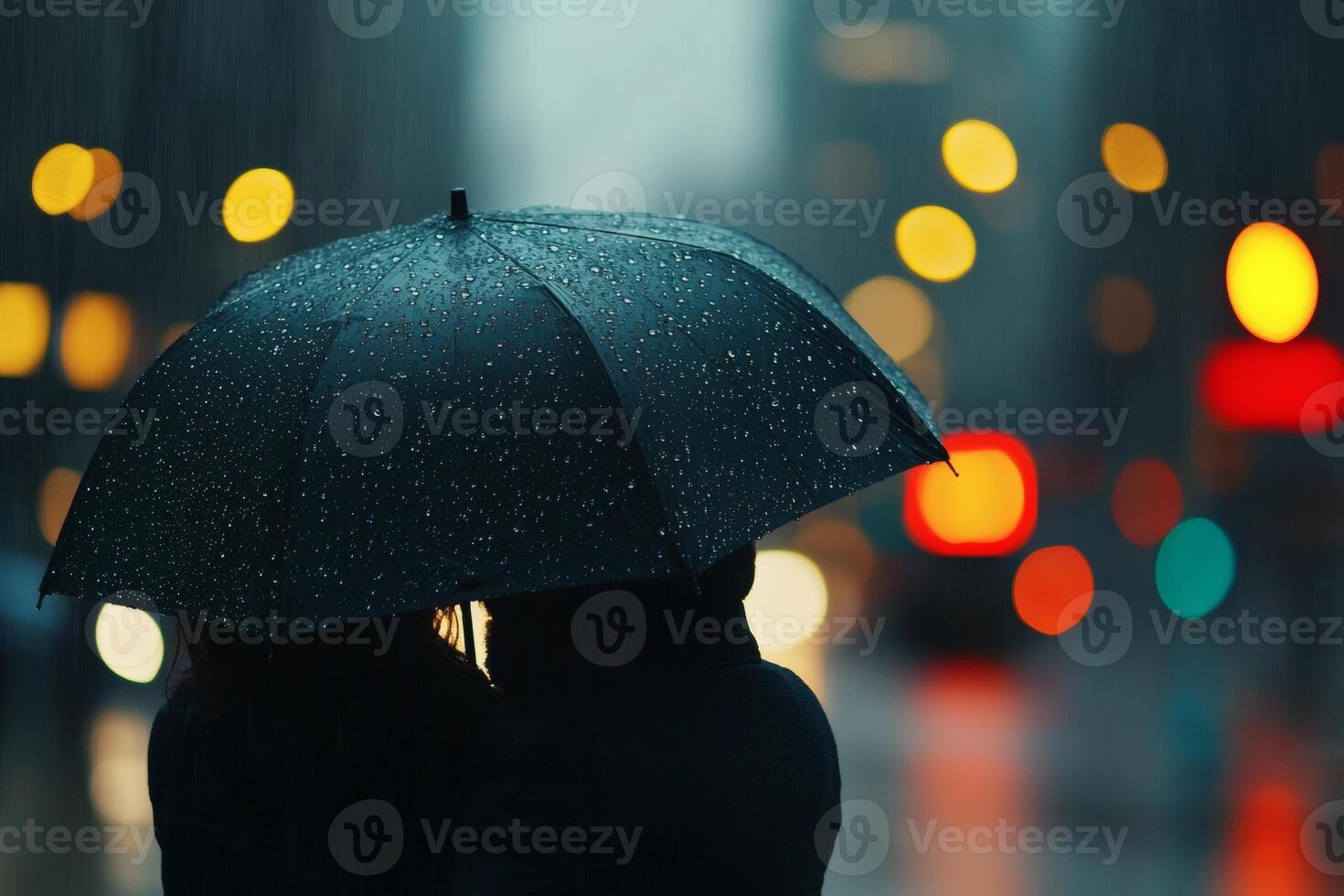 Couple under umbrella in the rain photo