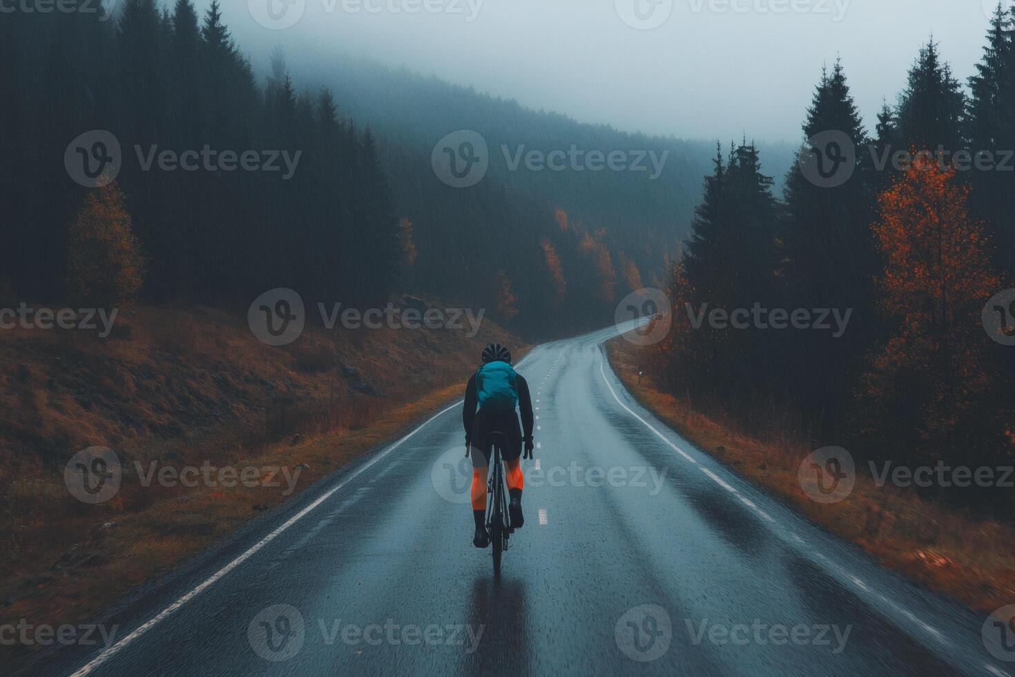 Misty mountain cycling on a quiet road photo