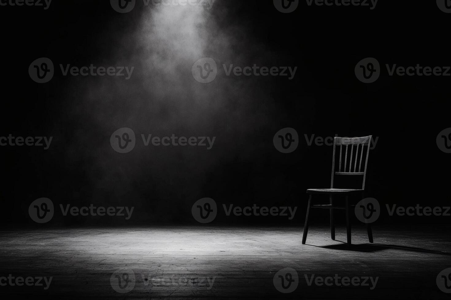 Solitude of a single chair under spotlight photo