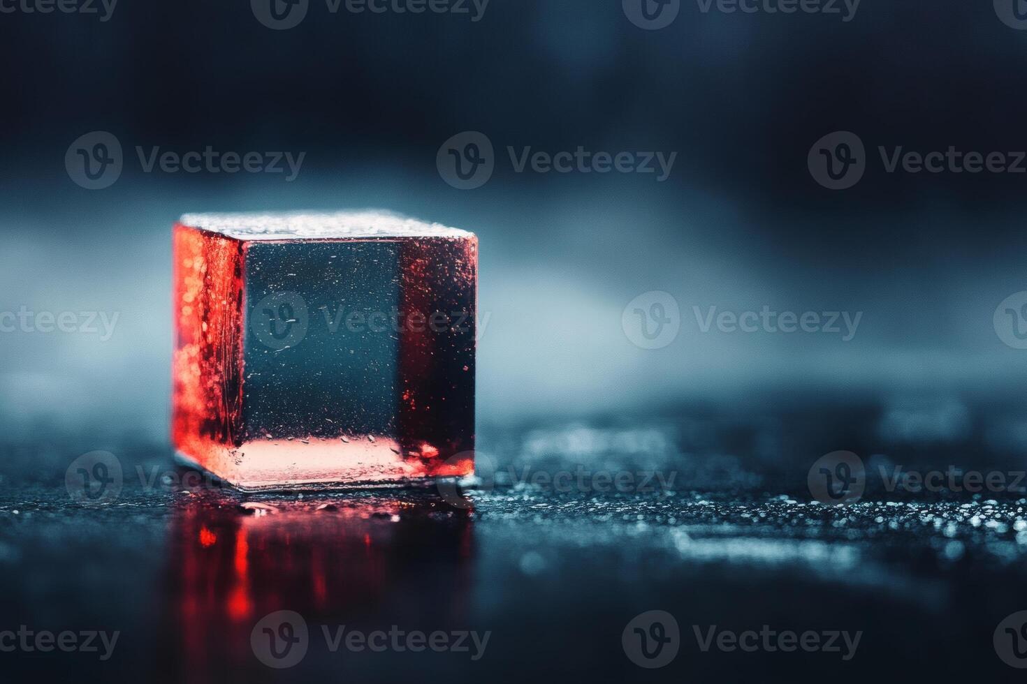Glowing red cube on a misty surface at night photo