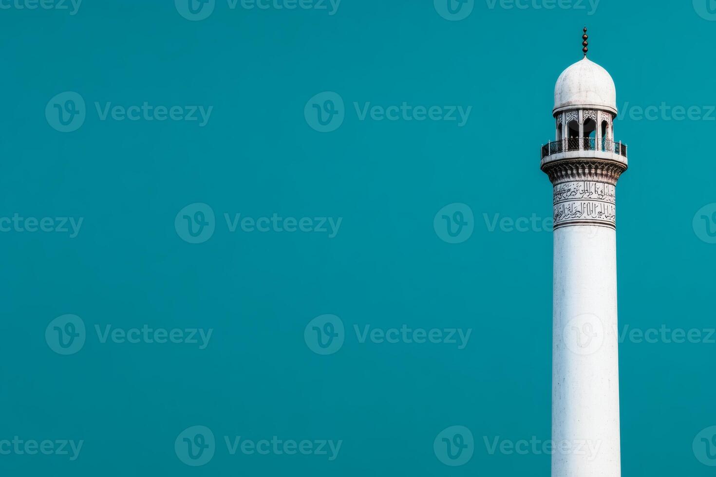Majestic minaret rising against clear sky photo