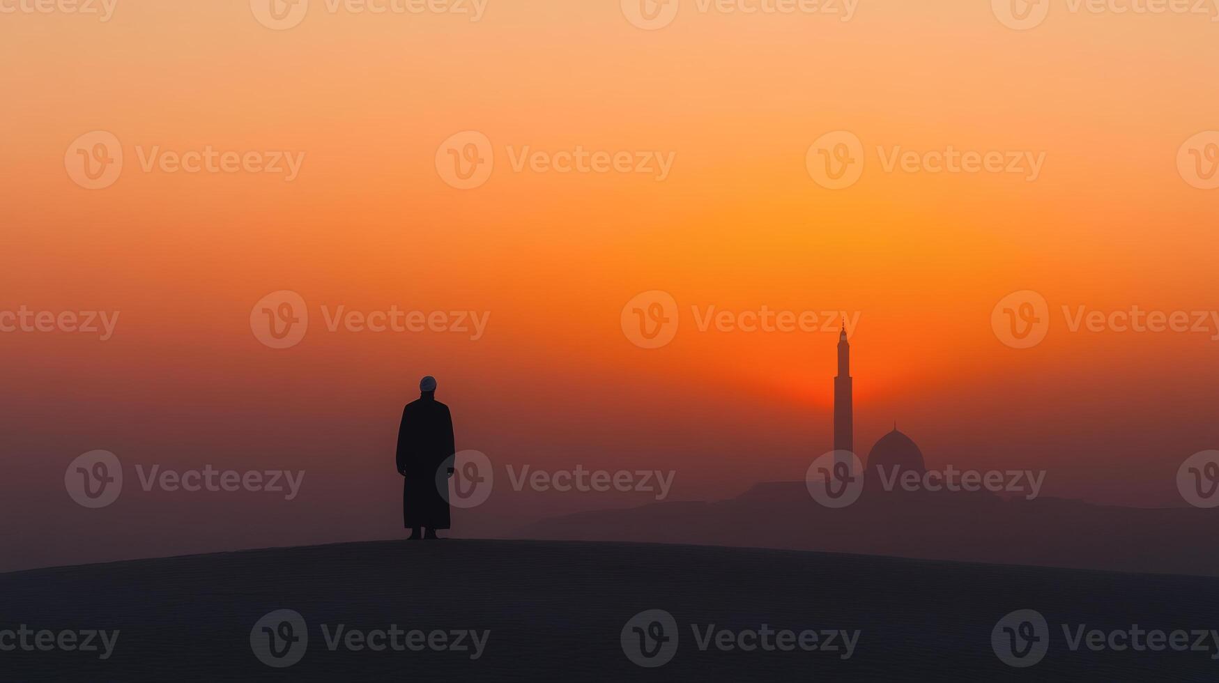 Silhouette at dawn near a distant minaret photo
