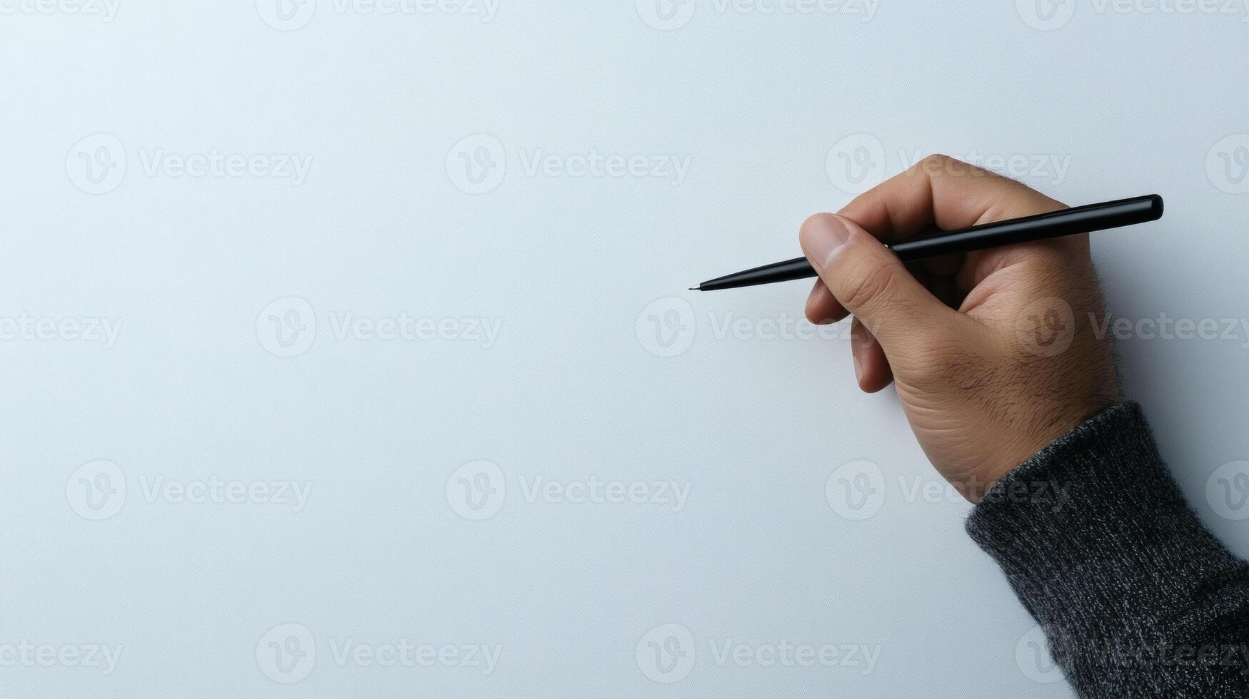 Hand poised to create art on blank canvas photo