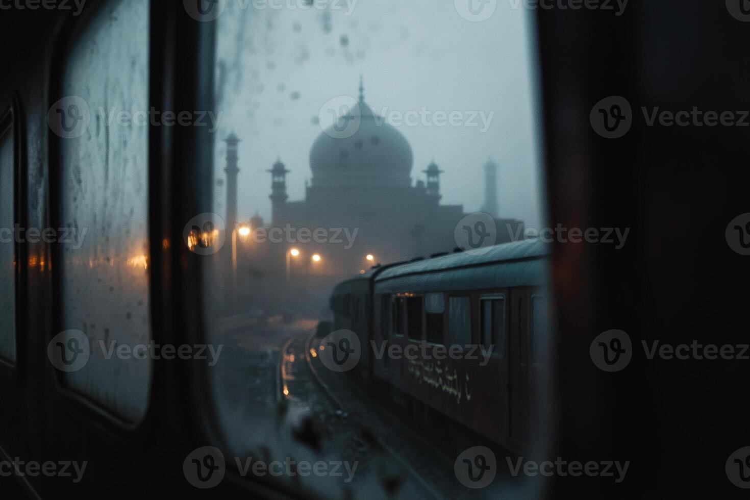 Glimpse of a majestic mausoleum through rain-splattered train windows in the early evening twilight photo