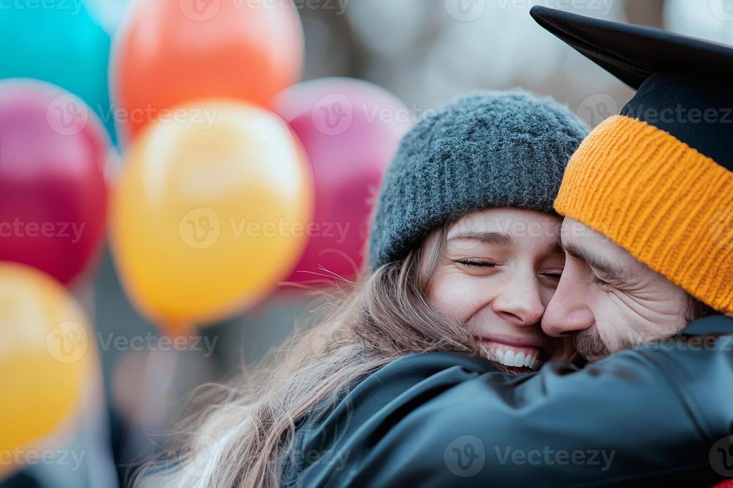 Celebration of achievement as graduate hugs loved one amidst colorful balloons and joyful atmosphere photo