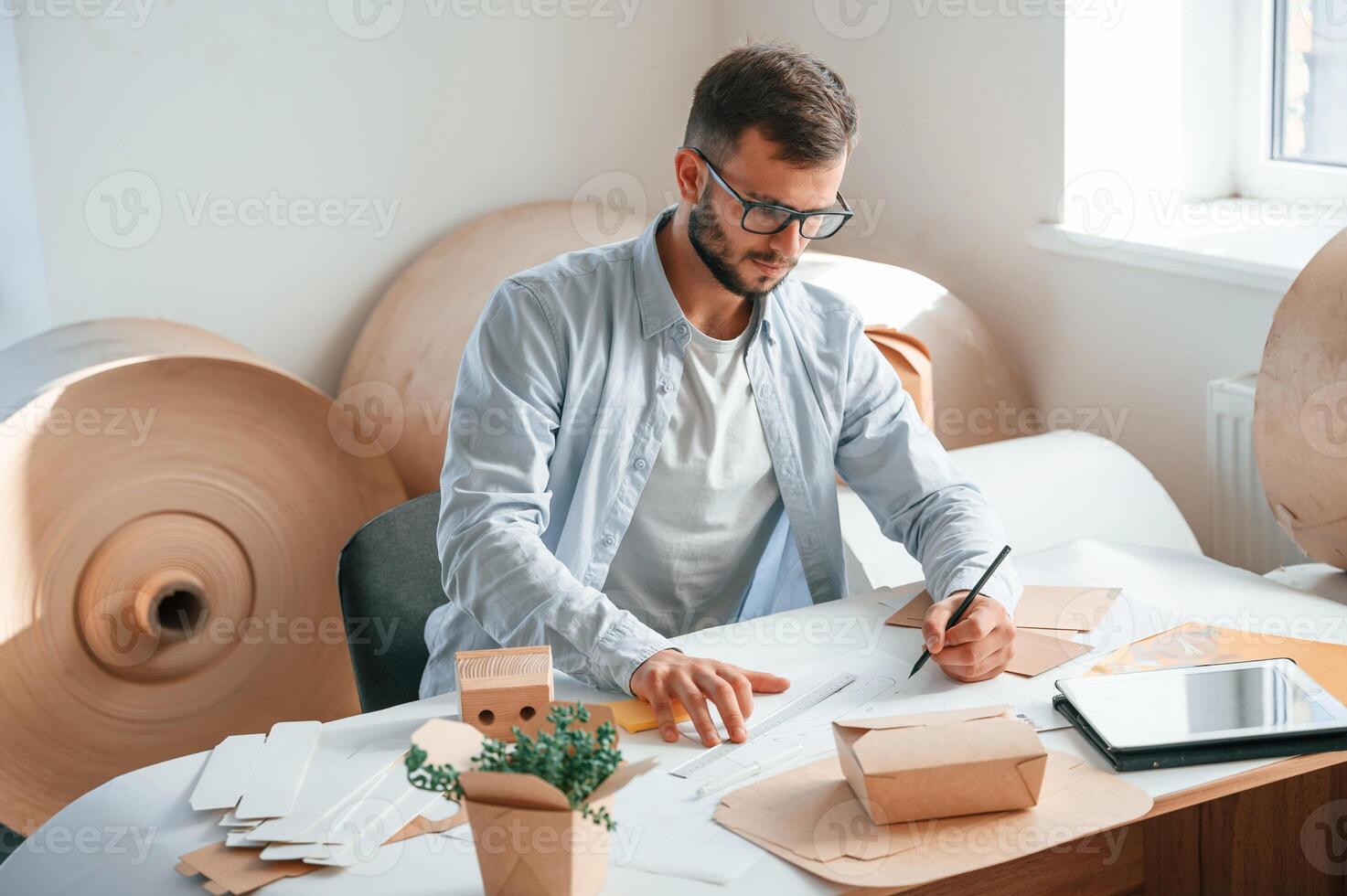 Drawing, by the table. Print, house worker in white clothes is indoors photo