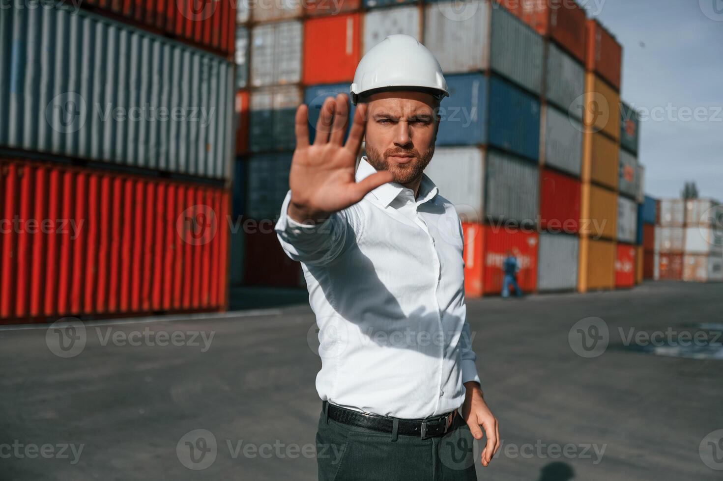 No, trespassing. Area is closed. Male worker is on the location with containers photo