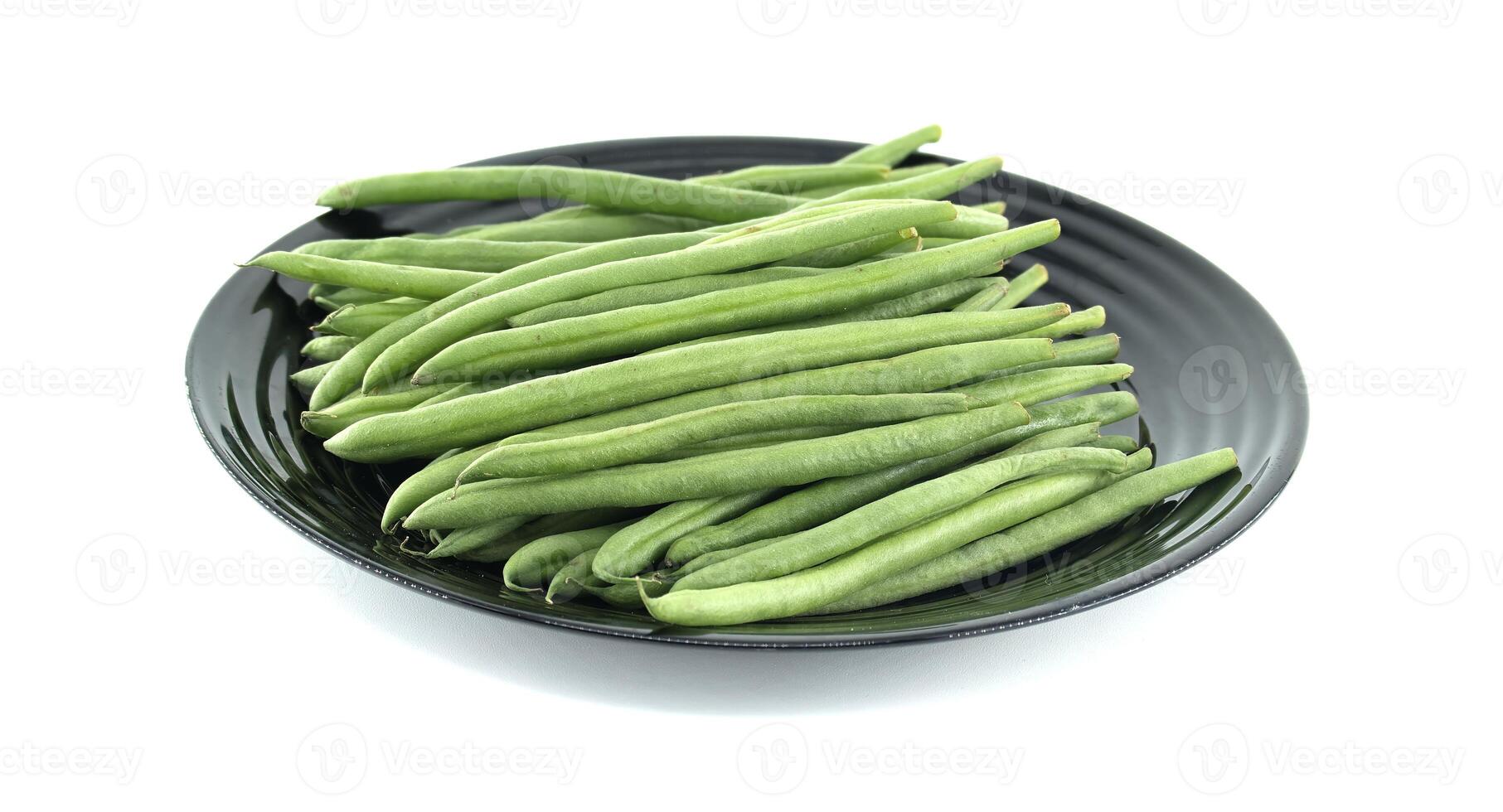 Fresh Green Beans Nicely Arranged on a Minimalistic Black Plate photo
