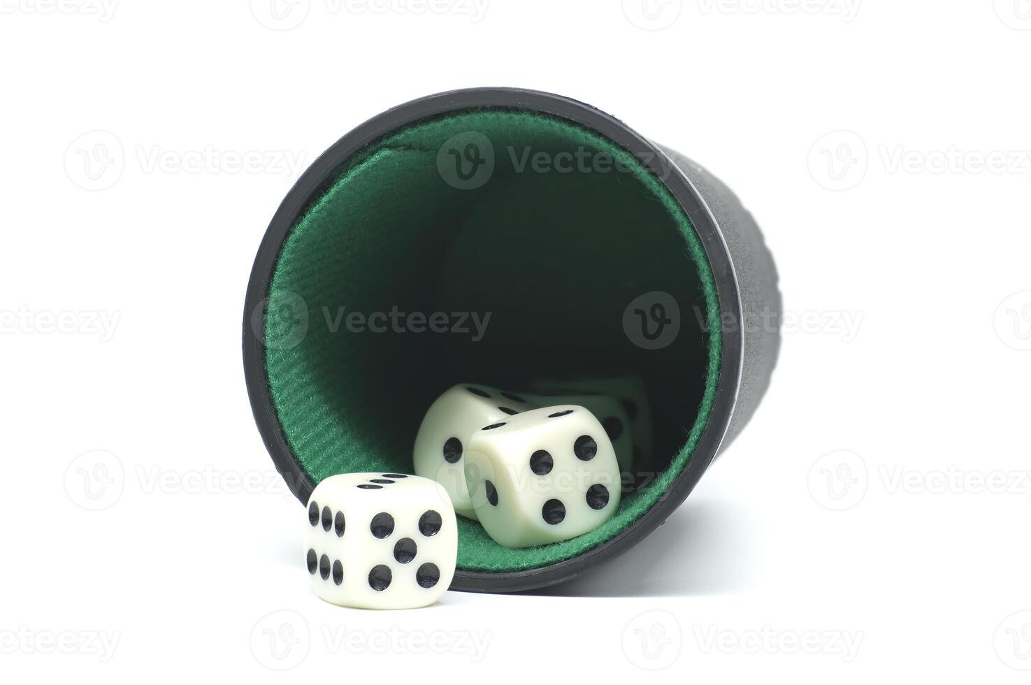 Dice Falling Out of a Cup on White Background photo