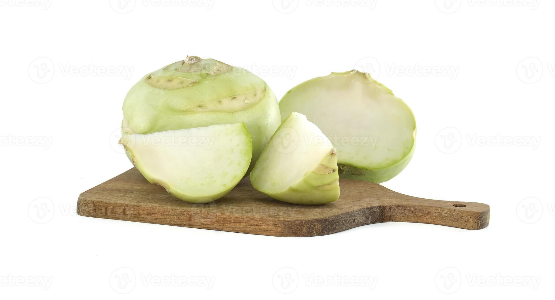 Fresh Whole and Sliced Kohlrabi on a Wooden Serving Board photo