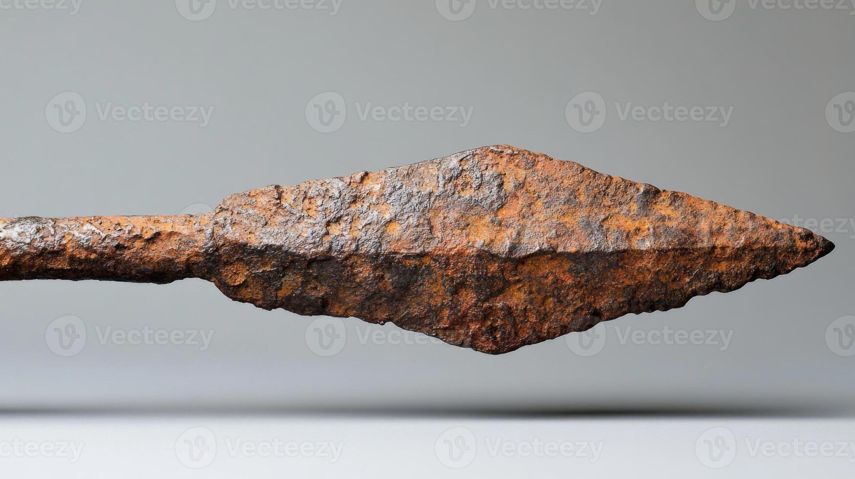 Ancient Rusty Spearhead. A Glimpse into the Past photo