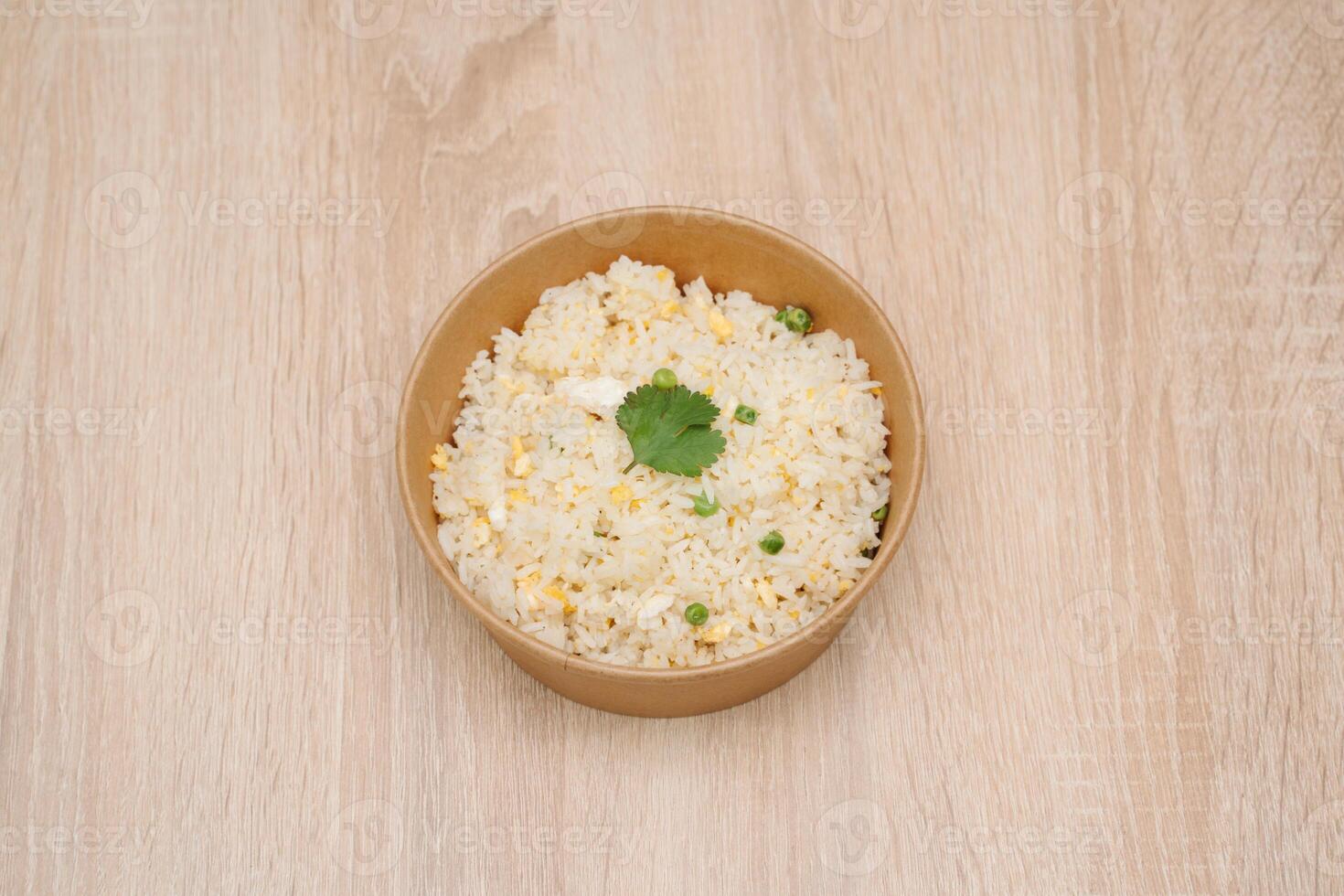 Simple Cantonese rice Cantonese shrimp rice in paper takeout container photo