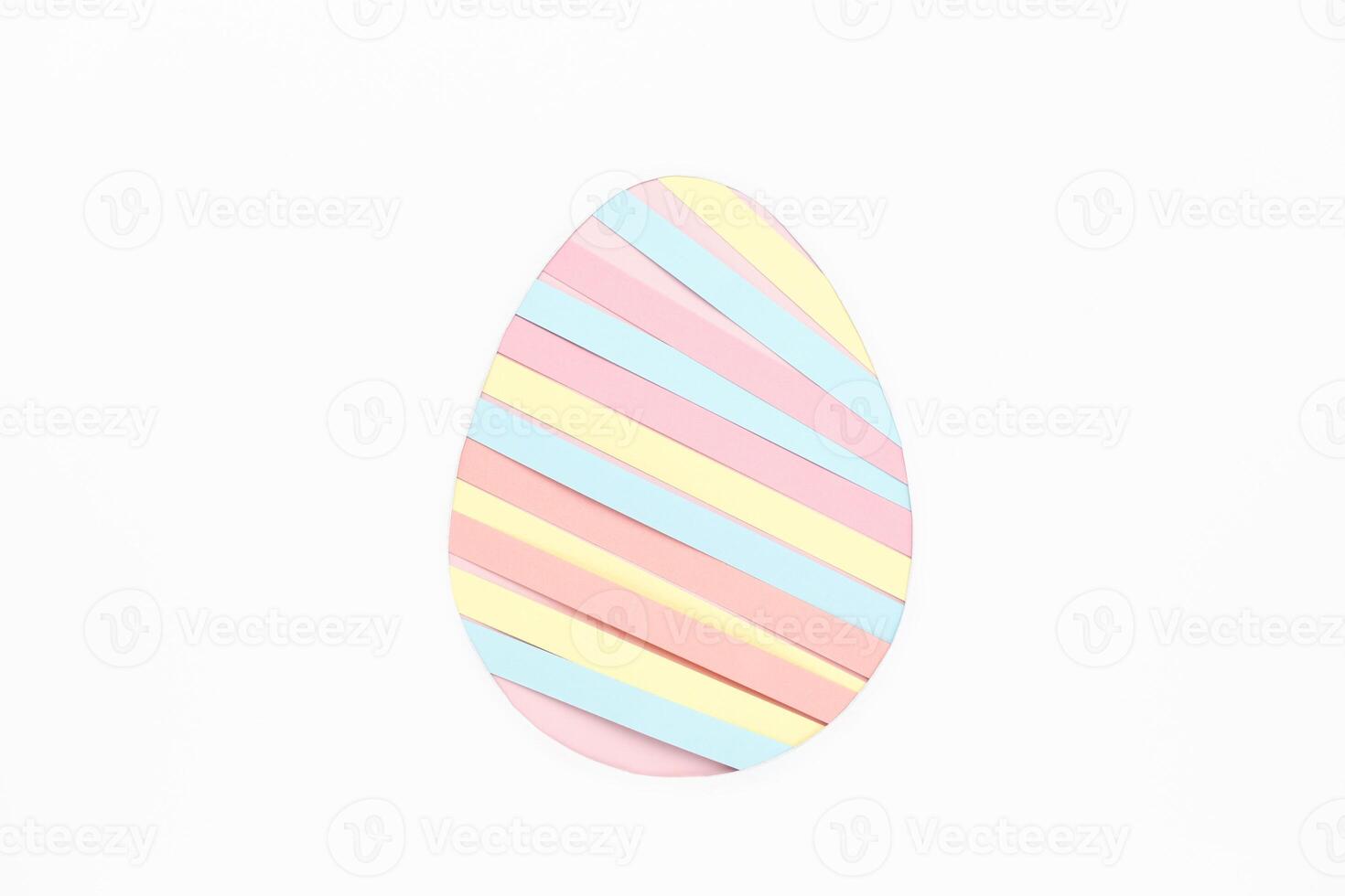 Paper strips in egg shape on white background photo