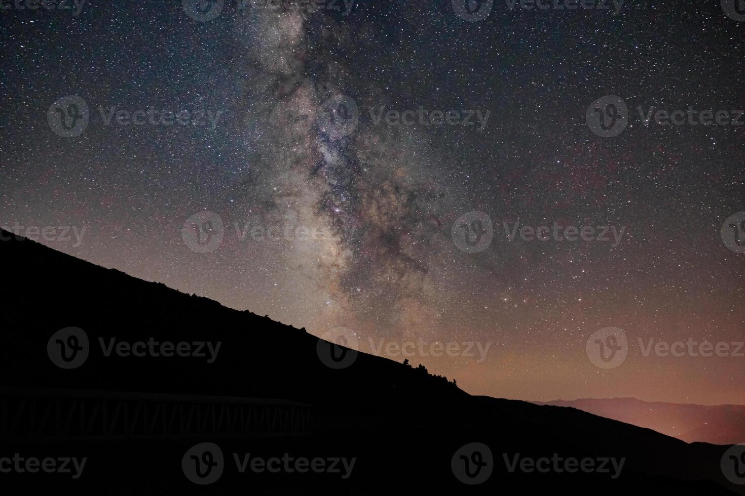 Silhouette of the hills with the Milky Way on the background photo