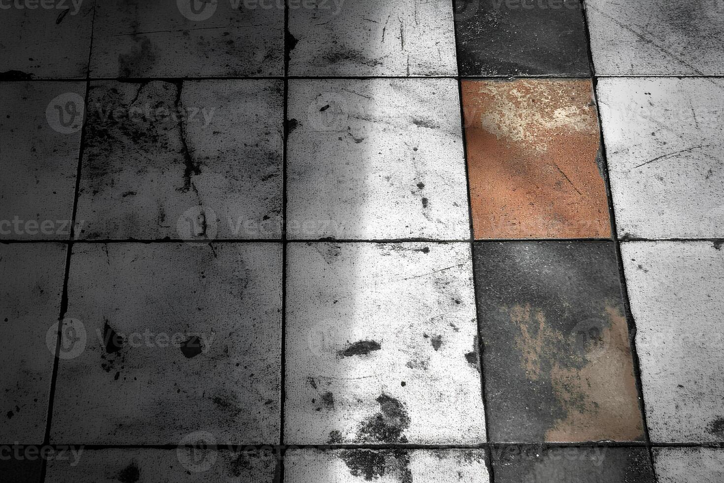 Detailed view of an old tile floor texture with shadows creating an abstract and textured design photo