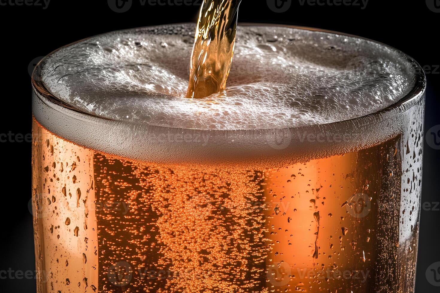 Close-up of beer being poured into a glass, with a dark background creating a dramatic and refreshing atmosphere photo