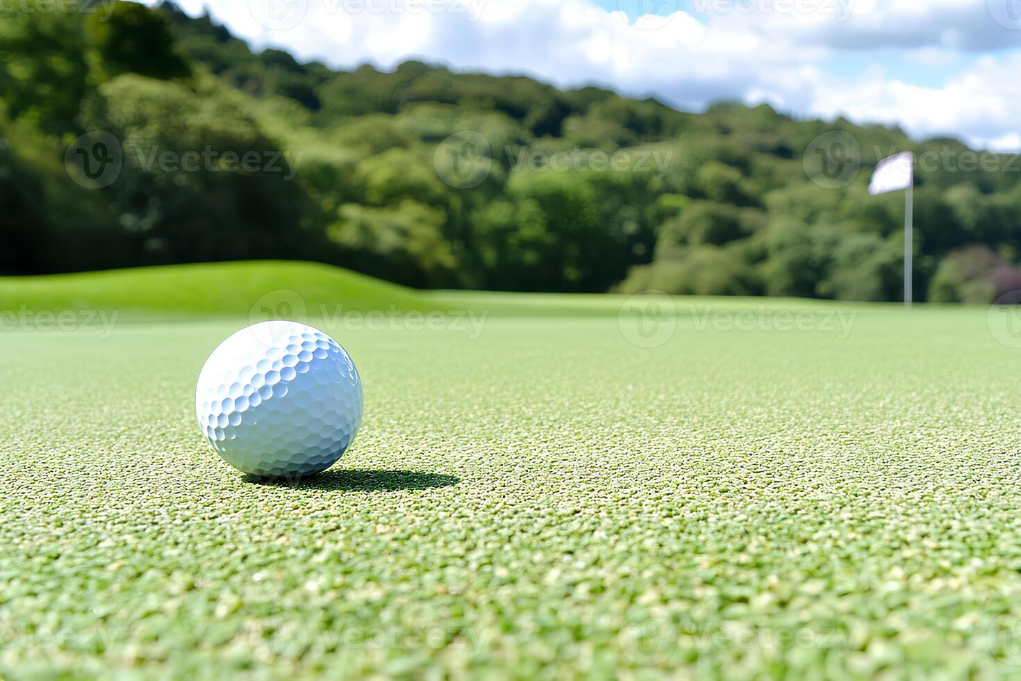 A golf ball resting on lush green grass with a shallow depth of field, emphasizing the ball in sharp focus while the background gently blurs, highlighting the moment of play photo