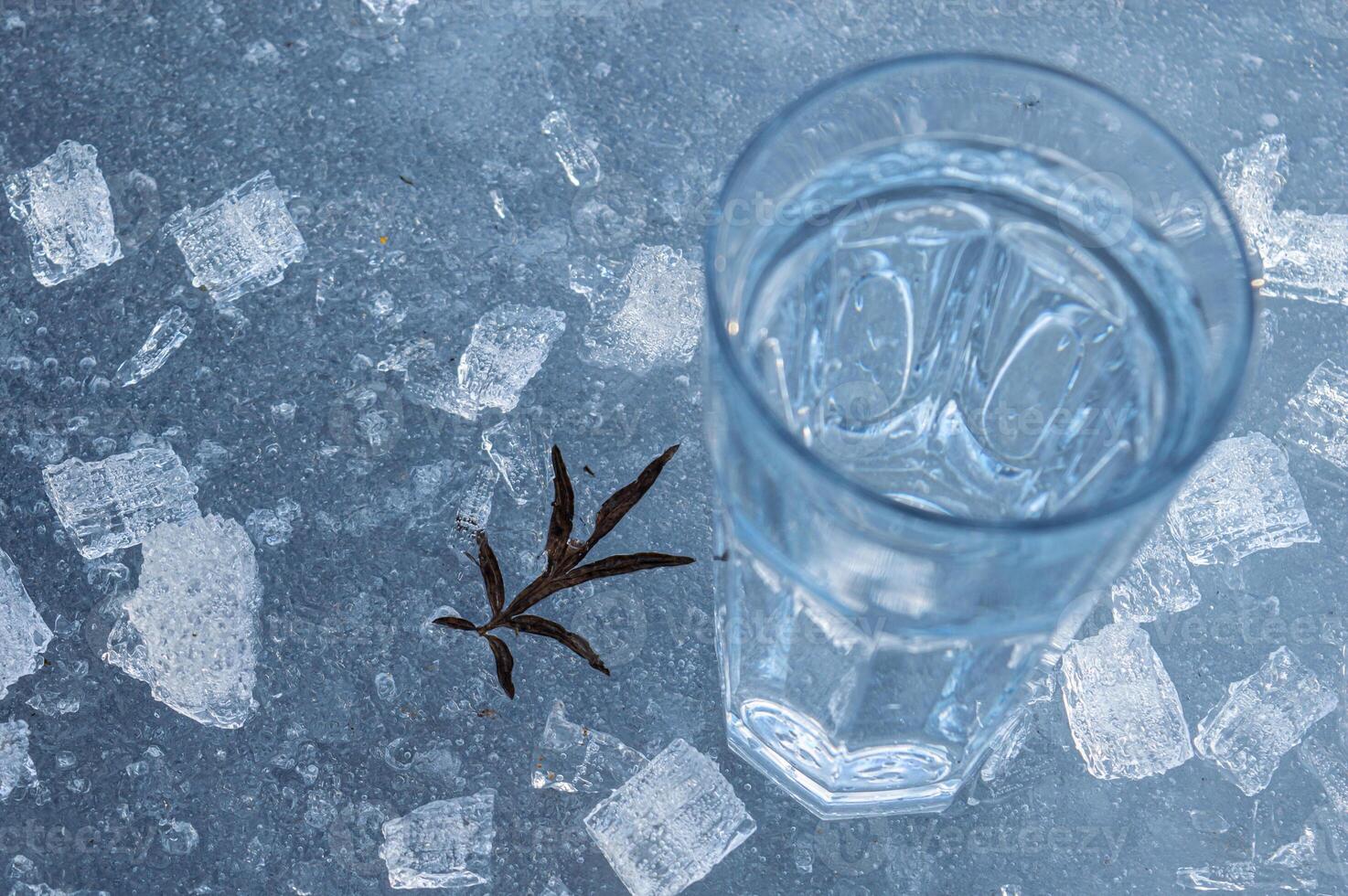 Beautiful transparent different pieces of ice on the ice surface. Pieces of ice filled with bubbles, a solid background. dishes, frozen water is clean. High quality photo