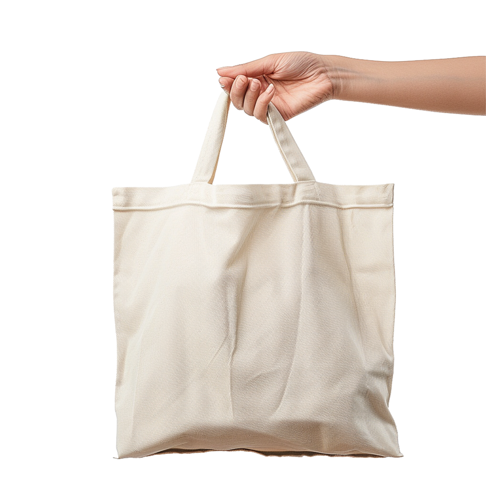 Woman's hand holding a beige tote bag eco friendly shopping bag png