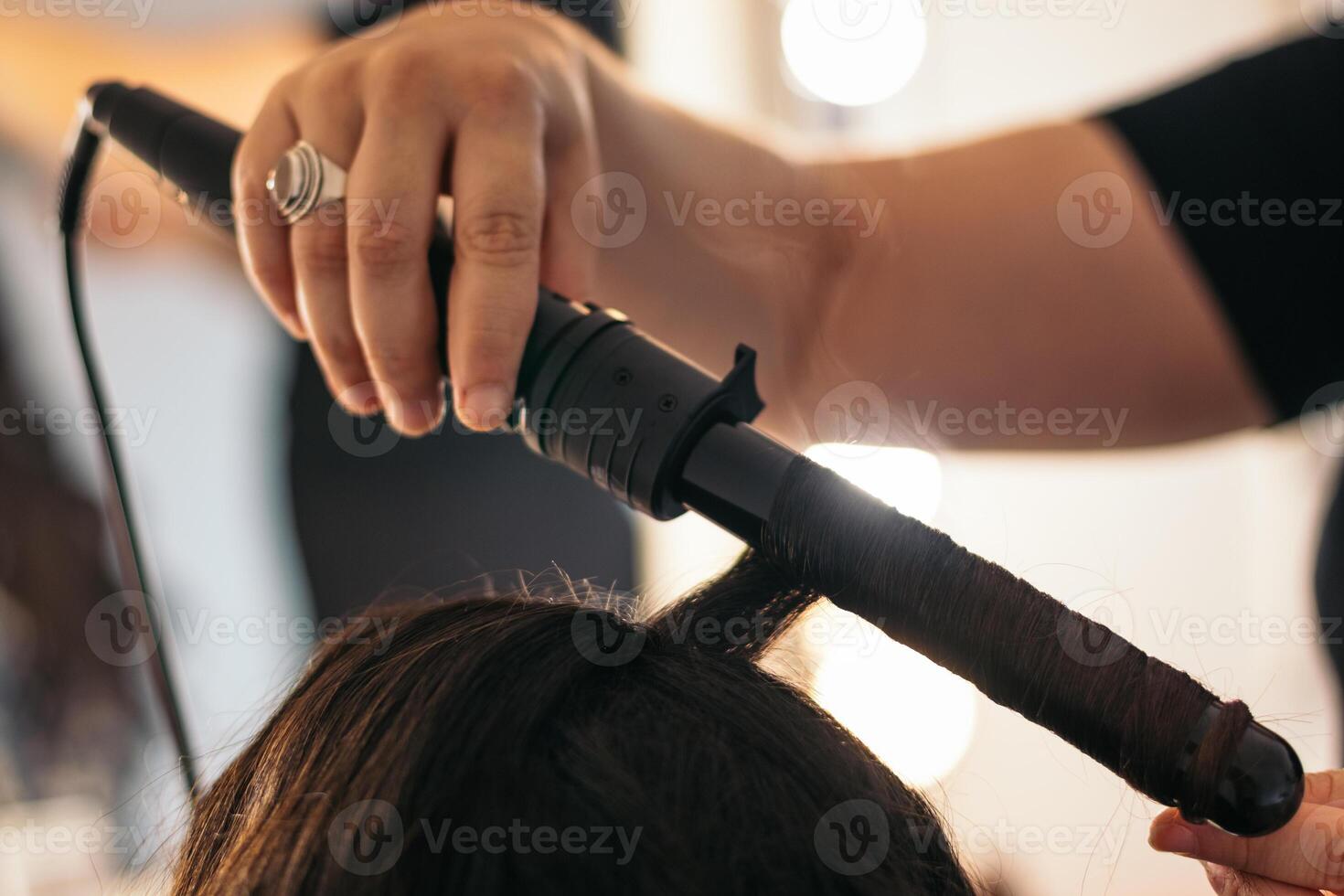 Close-up of a hair curler with which someone is making waves photo