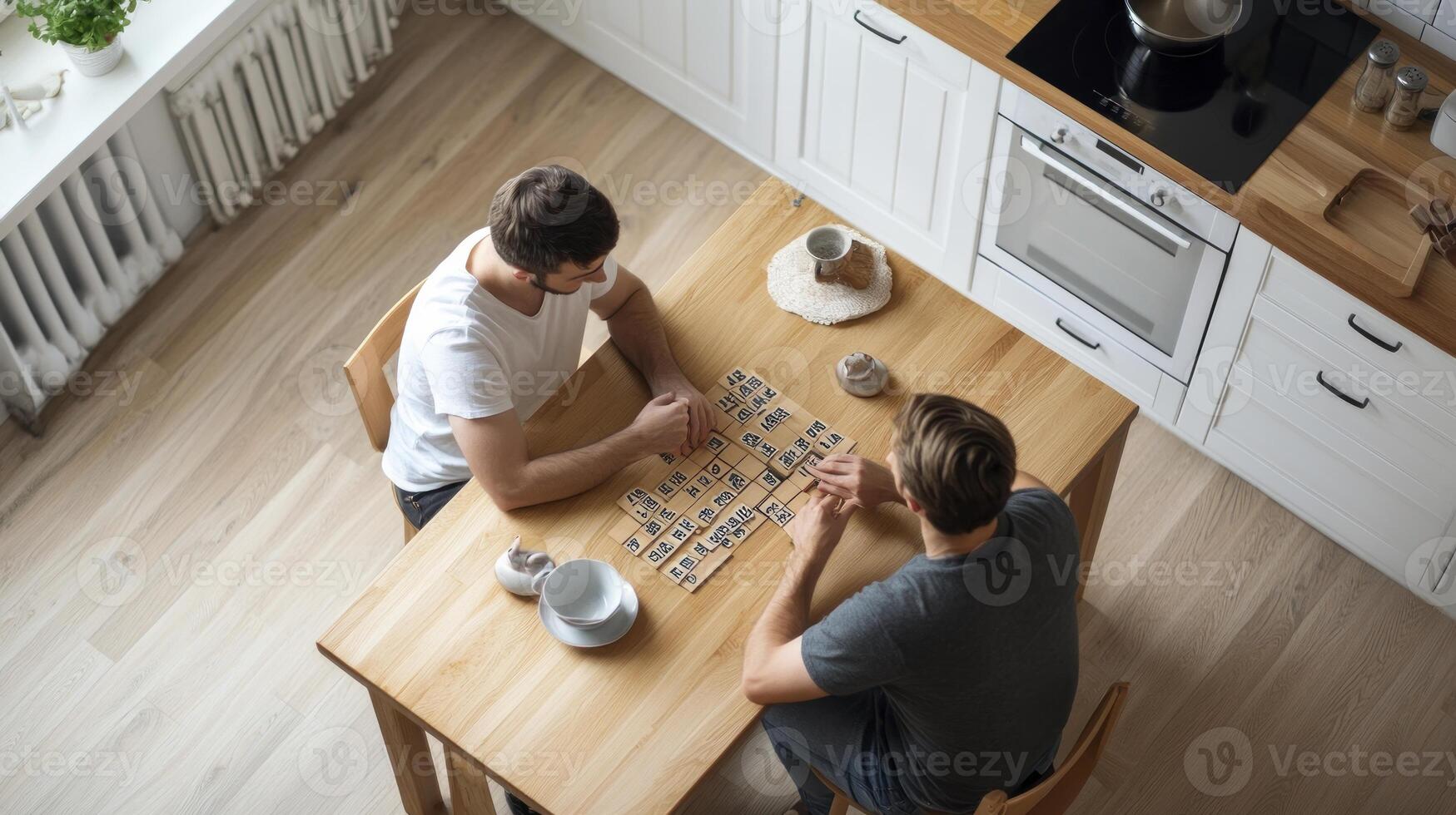 Two men playing a board game at a kitchen table photo