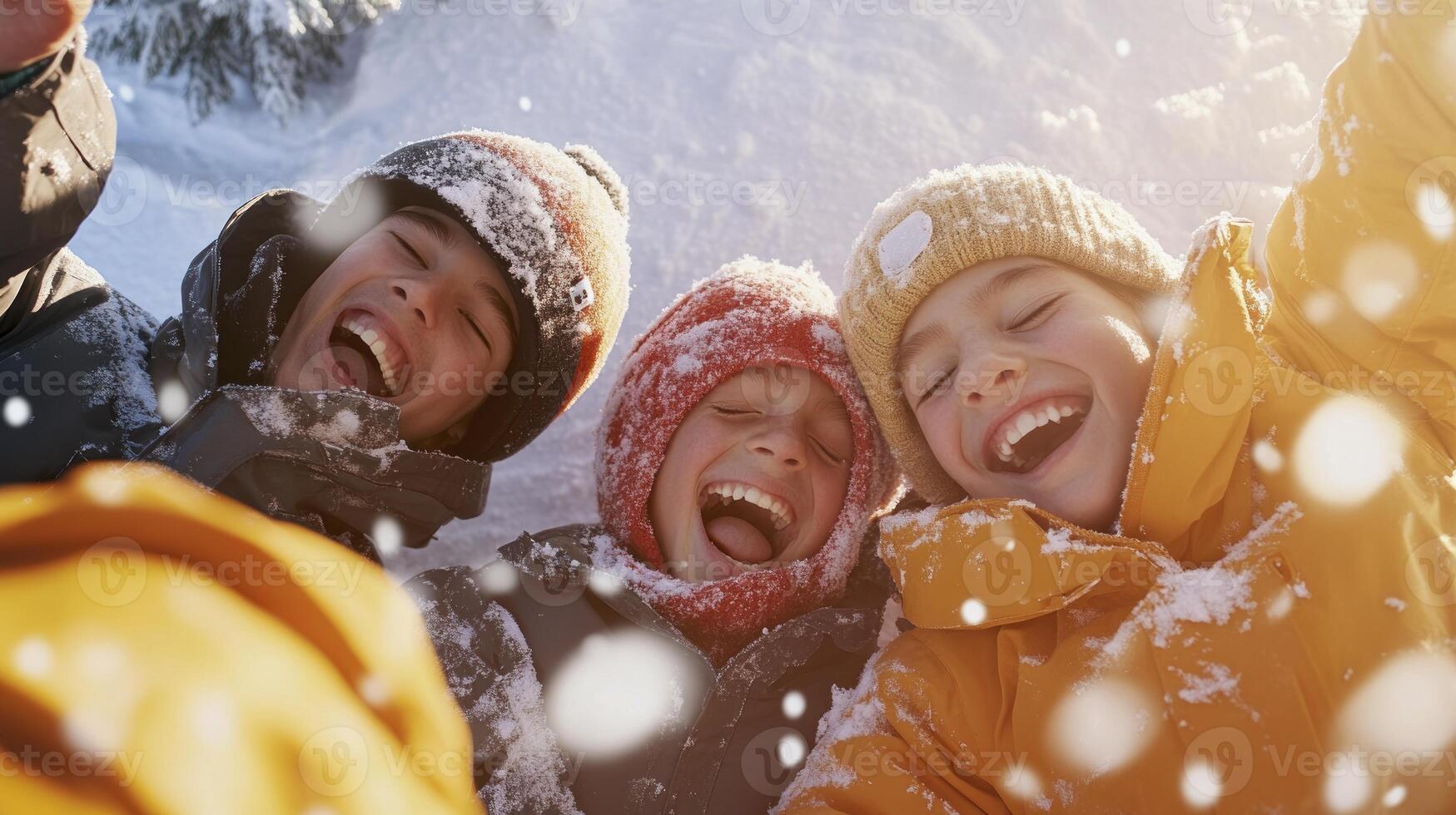 Three children are laughing in the snow photo