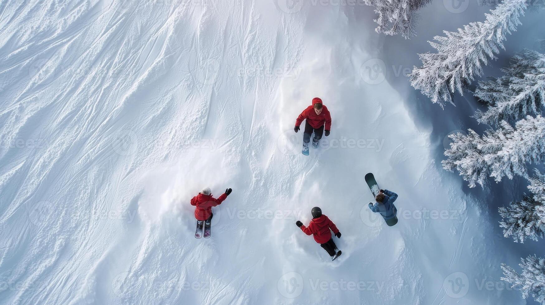 Four people are riding snowboards down a snowy slope photo