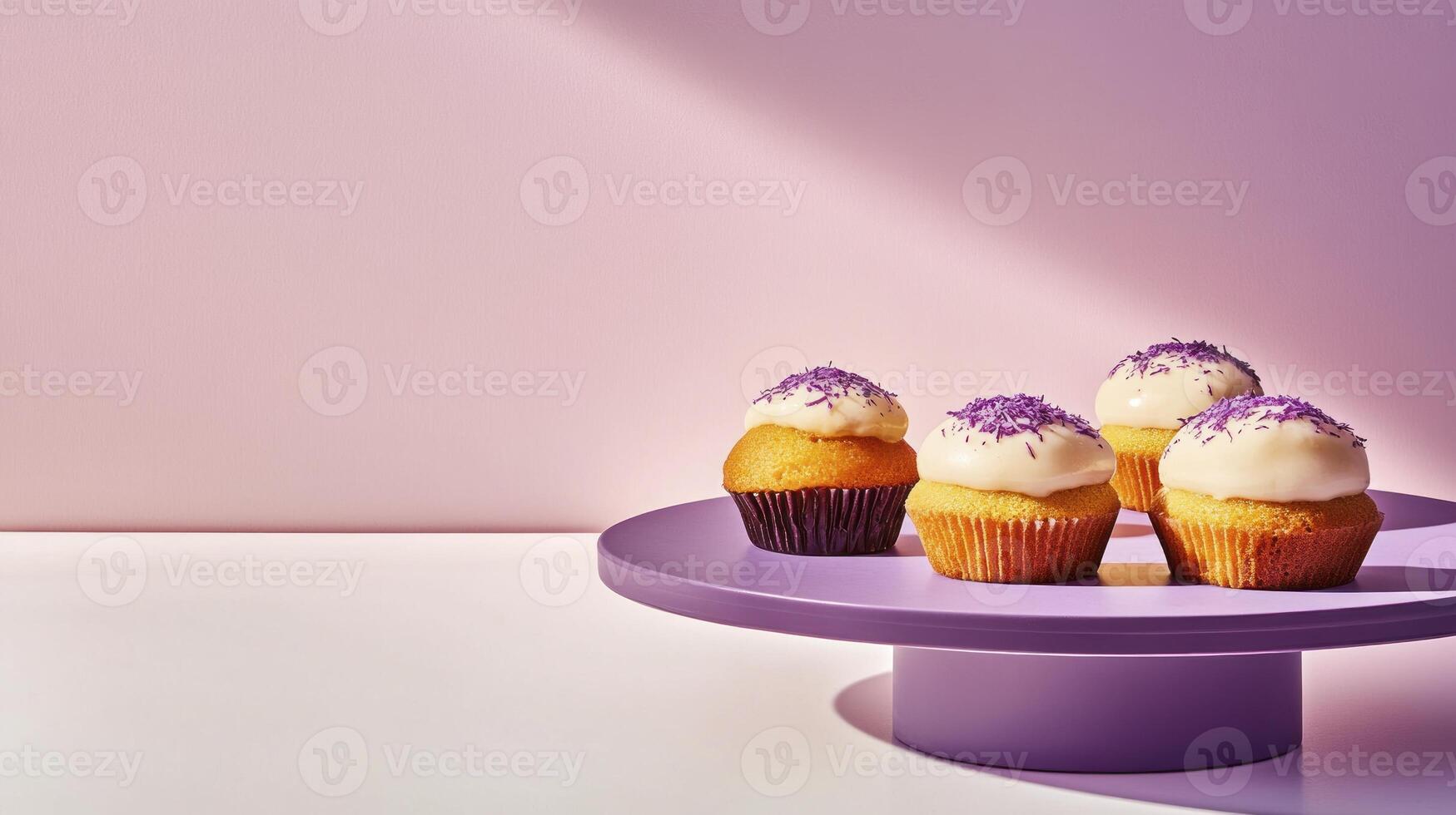 Four cupcakes on a purple plate with purple frosting photo