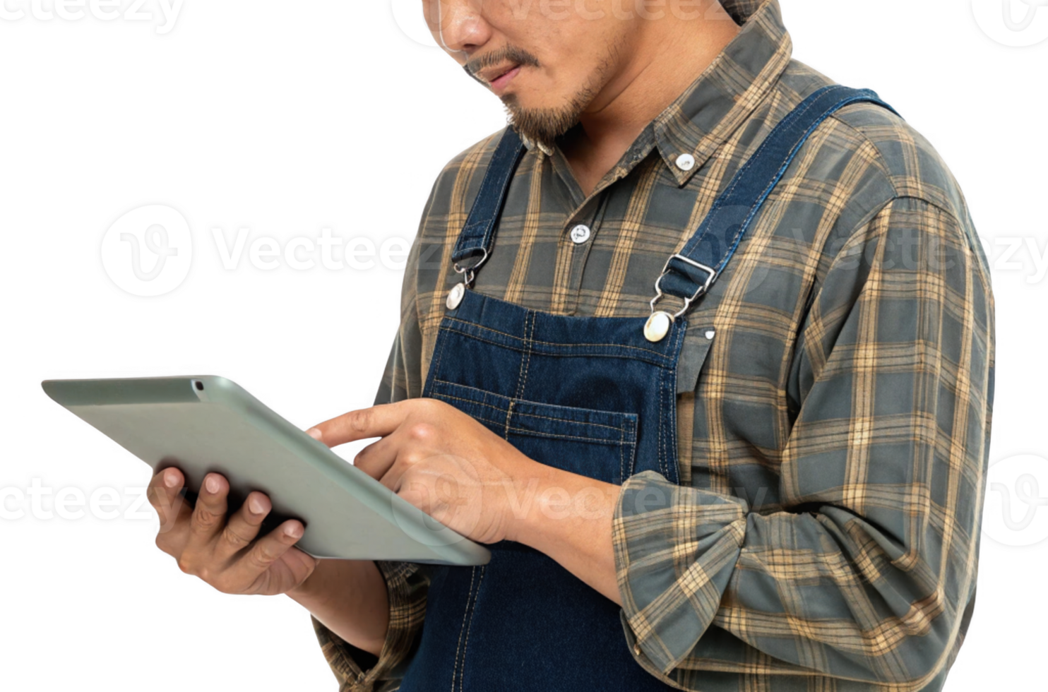 man in plaid shirt and overalls uses tablet, showcasing blend of food and technology in modern life png