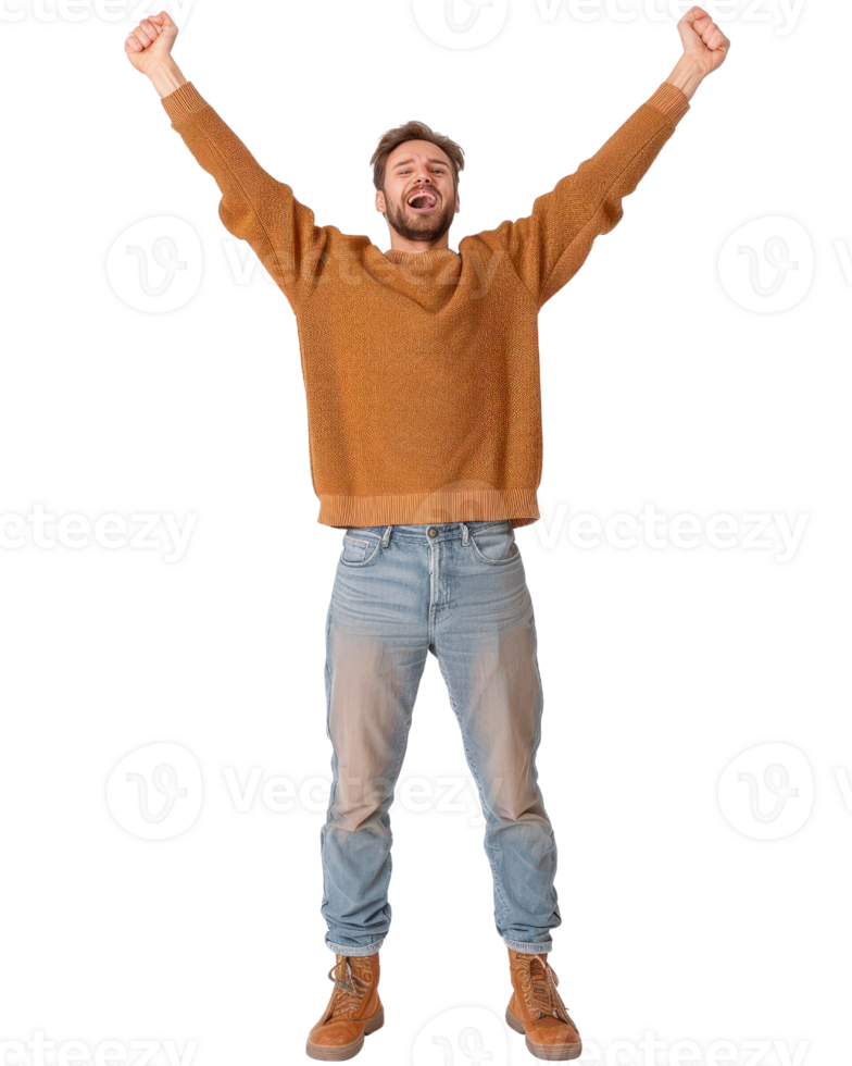 Happy young man celebrating success with arms raised, wearing a cozy sweater and jeans, standing confidently on white background png