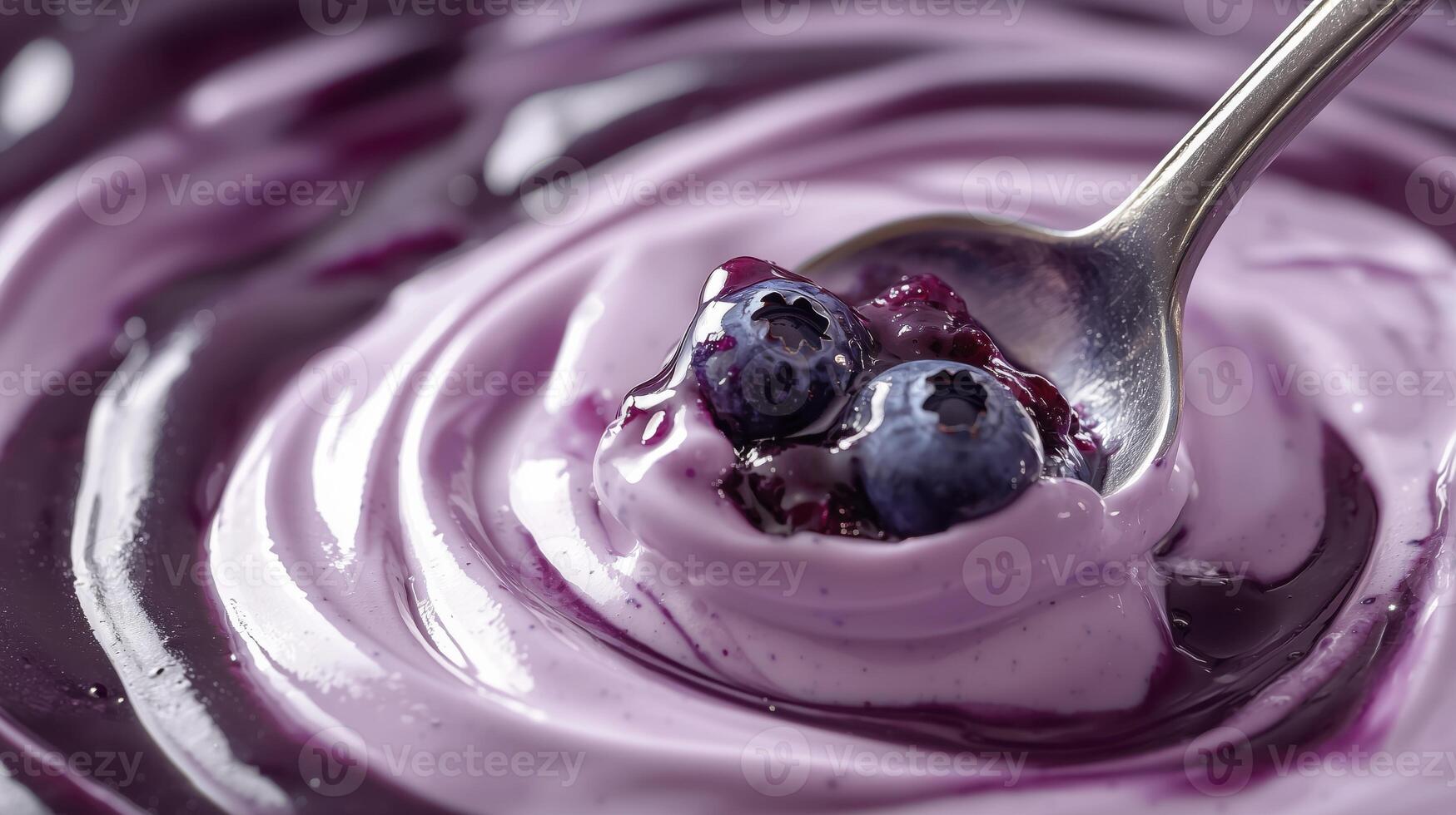 Blueberry yogurt with fresh berries scooped by a spoon, creamy and delicious texture photo