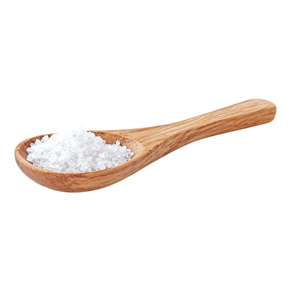Wooden spoon holding coarse salt on a kitchen counter with natural lighting highlighting the textures and colors png