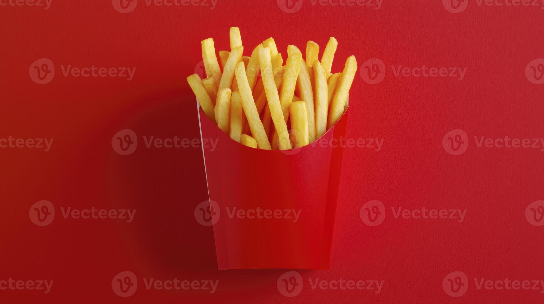 French fries in red box with copy space on red background photo